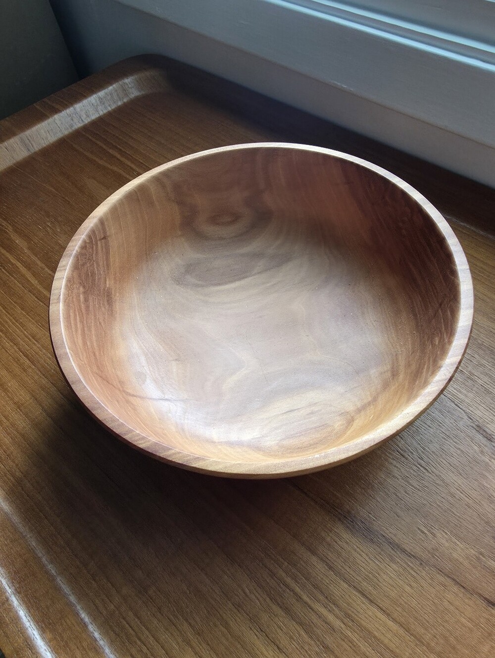 Handcrafted wooden bowl,  smooth, polished finish and  distinct.